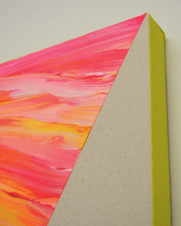 A close crop of the detail from a painting that has heavily applied fluorescent tones of red, yellow and orange - heavily applied with a marble effect and a sharp edge that gives a clean line to the natural canvas underneath, the painting canvas has a fluorescent yellow edge