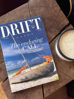 a copy of Drift magazine on a coffee table